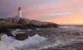 PeggyÃ¢â¬â¢s Cove Lighthouse illuminated at sunset, Nova Scotia